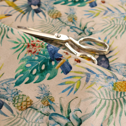 A tropical watercolour pattern featuring perched toucans, parrots, and pineapples surrounded by lush palm leaves on a cream background.