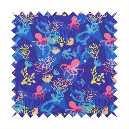 A vibrant nautical pattern featuring pink octopuses, yellow coral branches, and textured sea sponges set against an electric indigo blue background.