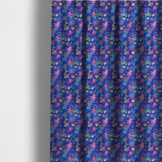 The fabric used to create these made-to-measure curtains is a vibrant nautical pattern featuring pink octopuses, yellow coral branches, and textured sea sponges set against an electric indigo blue background.
