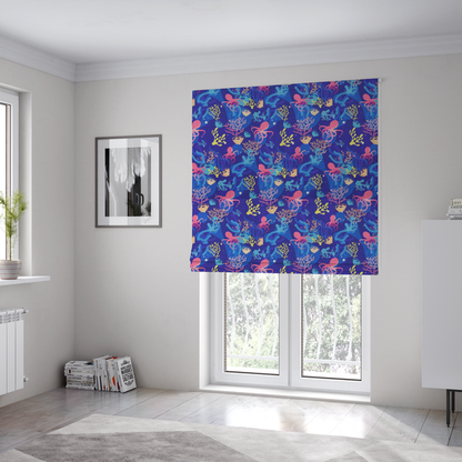 The fabric used to create these Roman blinds is a vibrant nautical pattern featuring pink octopuses, yellow coral branches, and textured sea sponges set against an electric indigo blue background.