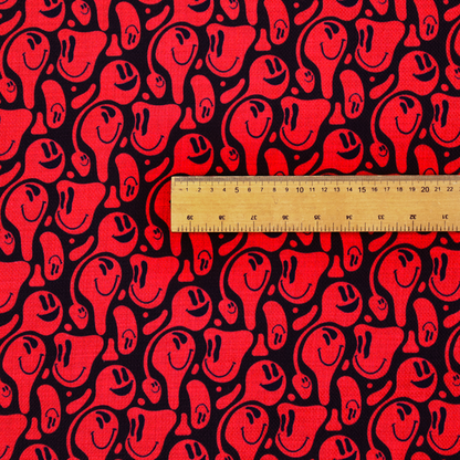 A repeating psychedelic pattern of vibrant red melting smiley faces and abstract kidney shapes set against a dark black background.