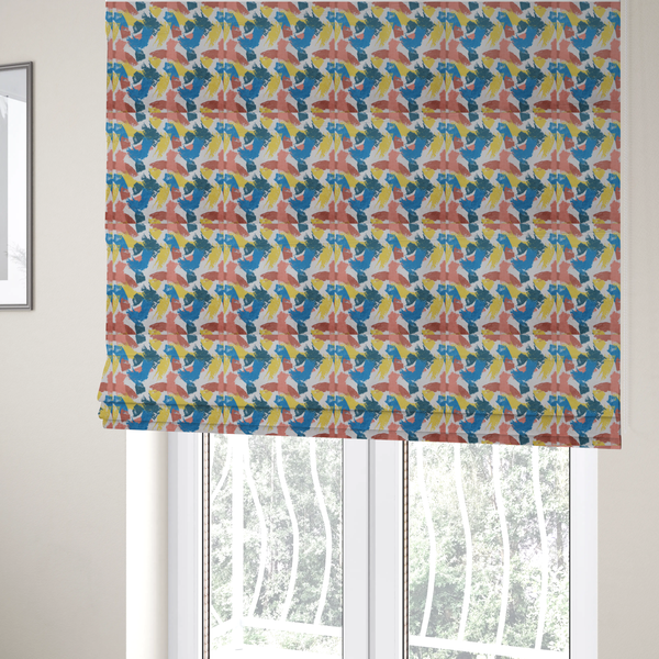The fabric used to create these Roman blinds is a vibrant textile print featuring large, expressive paint swipes in cornflower blue, sunny yellow, terracotta red, and dark teal. The brushstrokes overlap to create a sense of movement and have a visible, dry-brush texture with distressed edges.
