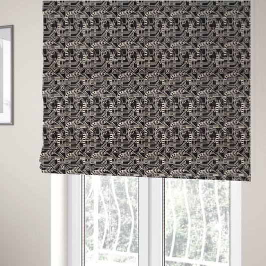 The fabric used to create these Roman blinds is an intricate black and white repeating pattern featuring a grid of tribal-inspired geometric motifs. The design displays stylized, interlocking serpentine and curved forms filled with detailed line work, dots, and hatch marks. Circular gear-like symbols and triangular accents create a structured, rhythmic composition with a high-contrast, hand-drawn aesthetic on a textured fabric.