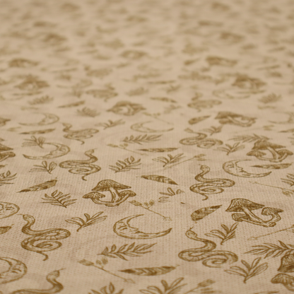 A light beige fabric featuring a repetitive boho-mystical pattern. The design is printed in a muted olive-brown ink and includes the following hand-drawn elements scattered across the material.