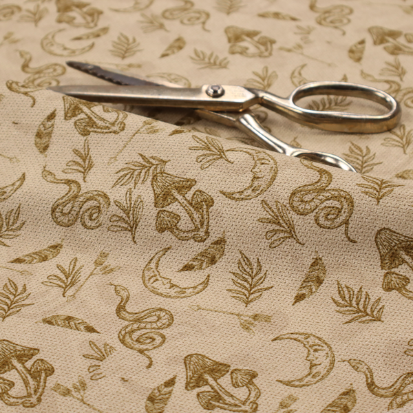 A light beige fabric featuring a repetitive boho-mystical pattern. The design is printed in a muted olive-brown ink and includes the following hand-drawn elements scattered across the material.