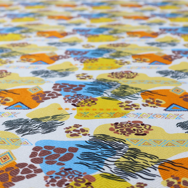 A vibrant, safari-themed repeating pattern on a white textured fabric, blending abstract shapes with traditional animal and tribal motifs.