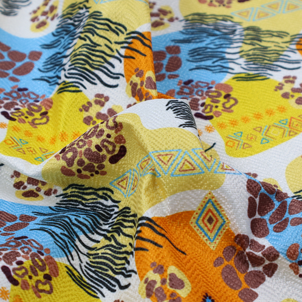 A vibrant, safari-themed repeating pattern on a white textured fabric, blending abstract shapes with traditional animal and tribal motifs.