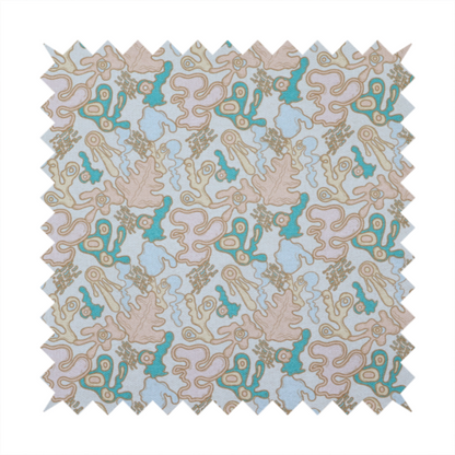 An overhead, flat-lay image of a light blue fabric featuring a whimsical, abstract botanical pattern. The design is composed of organic, flowing shapes and illustrations in a pastel and jewel-tone palette.