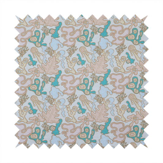 An overhead, flat-lay image of a light blue fabric featuring a whimsical, abstract botanical pattern. The design is composed of organic, flowing shapes and illustrations in a pastel and jewel-tone palette.