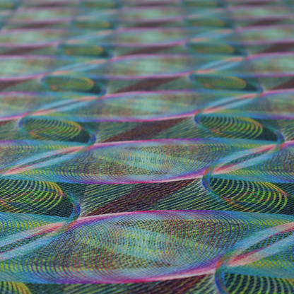 This fabric features a dynamic, futuristic geometric pattern in shades of pink, blue and green, with a mesmerizing sense of movement and depth.