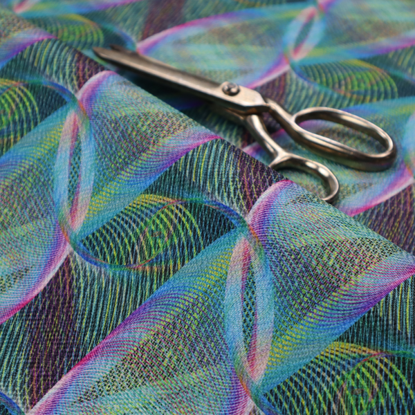 This fabric features a dynamic, futuristic geometric pattern in shades of pink, blue and green, with a mesmerizing sense of movement and depth.