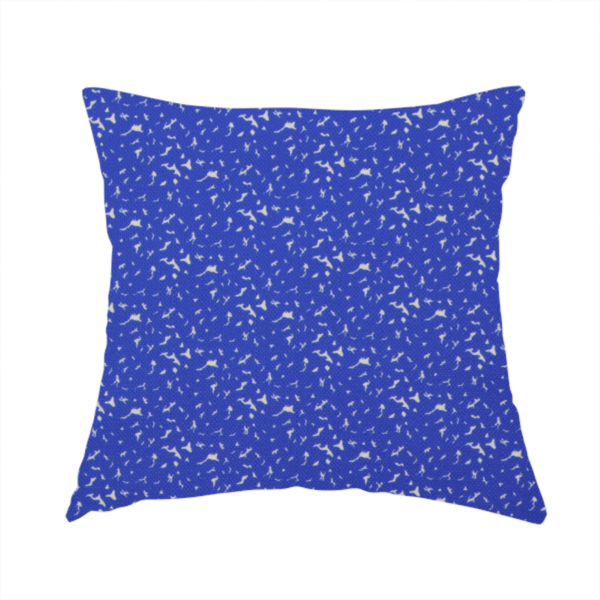 The fabric used to create this handmade cushions is a bright cobalt blue fabric with a dense, non-directional "speckle" or "splatter" pattern.
