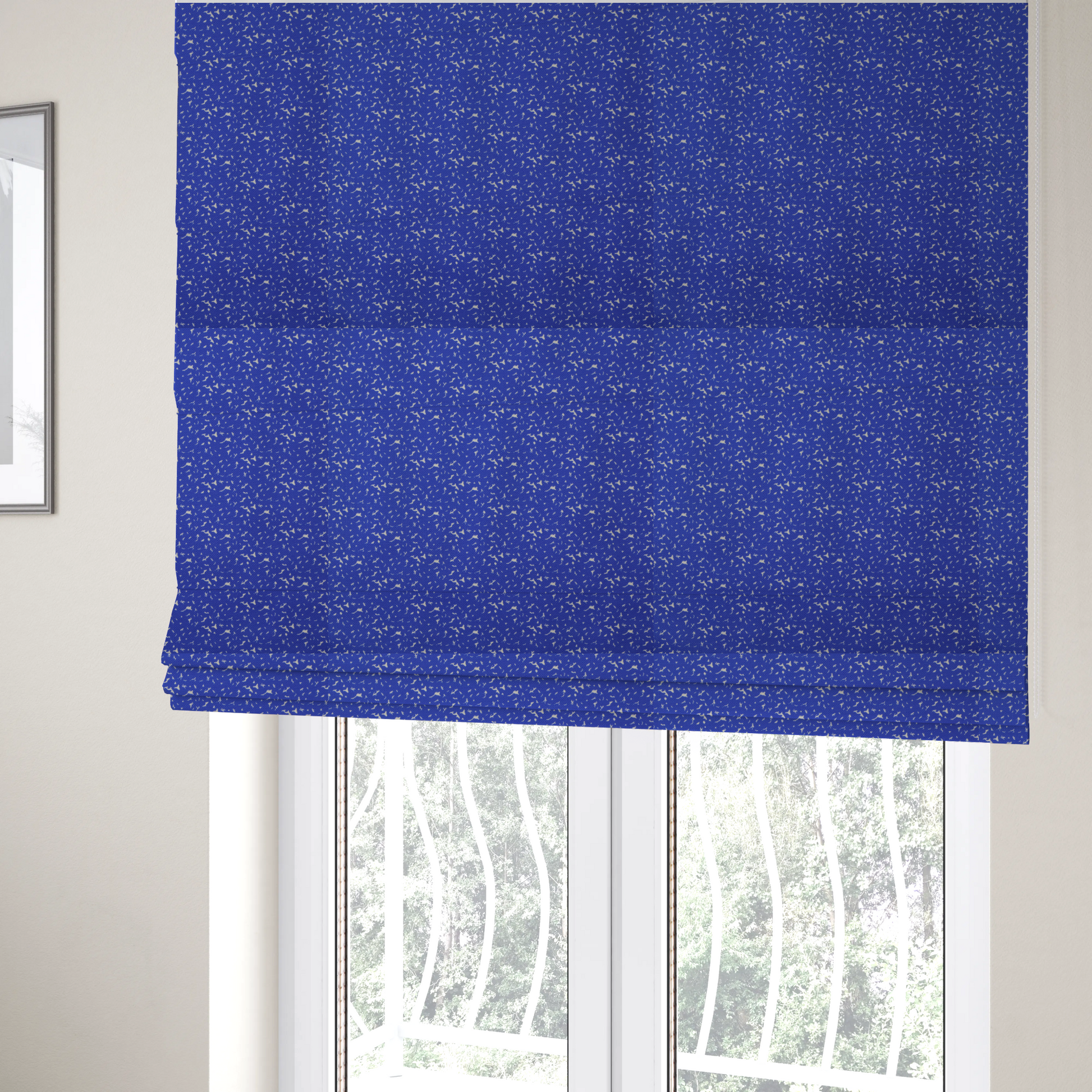The fabric used to create these Roman blinds is a bright cobalt blue fabric with a dense, non-directional "speckle" or "splatter" pattern.