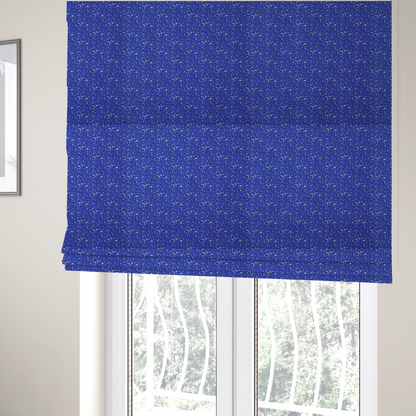 The fabric used to create these Roman blinds is a bright cobalt blue fabric with a dense, non-directional "speckle" or "splatter" pattern.