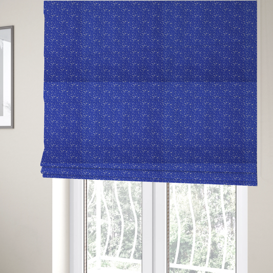 The fabric used to create these Roman blinds is a bright cobalt blue fabric with a dense, non-directional "speckle" or "splatter" pattern.