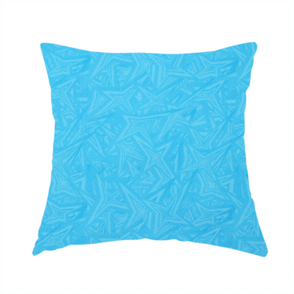 The fabric used to create this handmade cushion is a vibrant cyan-coloured fabric featuring a subtle, tonal geometric pattern.