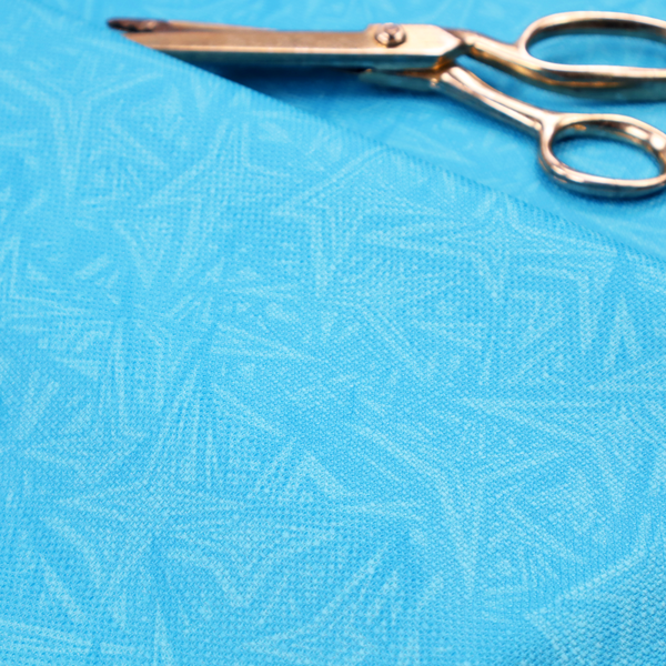 A vibrant cyan-coloured fabric featuring a subtle, tonal geometric pattern.