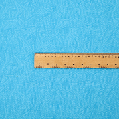 A vibrant cyan-coloured fabric featuring a subtle, tonal geometric pattern.