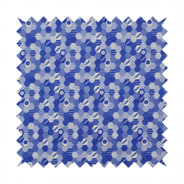 A detailed geometric fabric featuring a dense honeycomb or hexagonal patchwork pattern in blue and white.