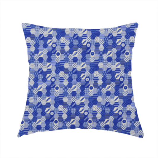 The fabric used to create this handmade cushion is a detailed geometric fabric featuring a dense honeycomb or hexagonal patchwork pattern in blue and white.