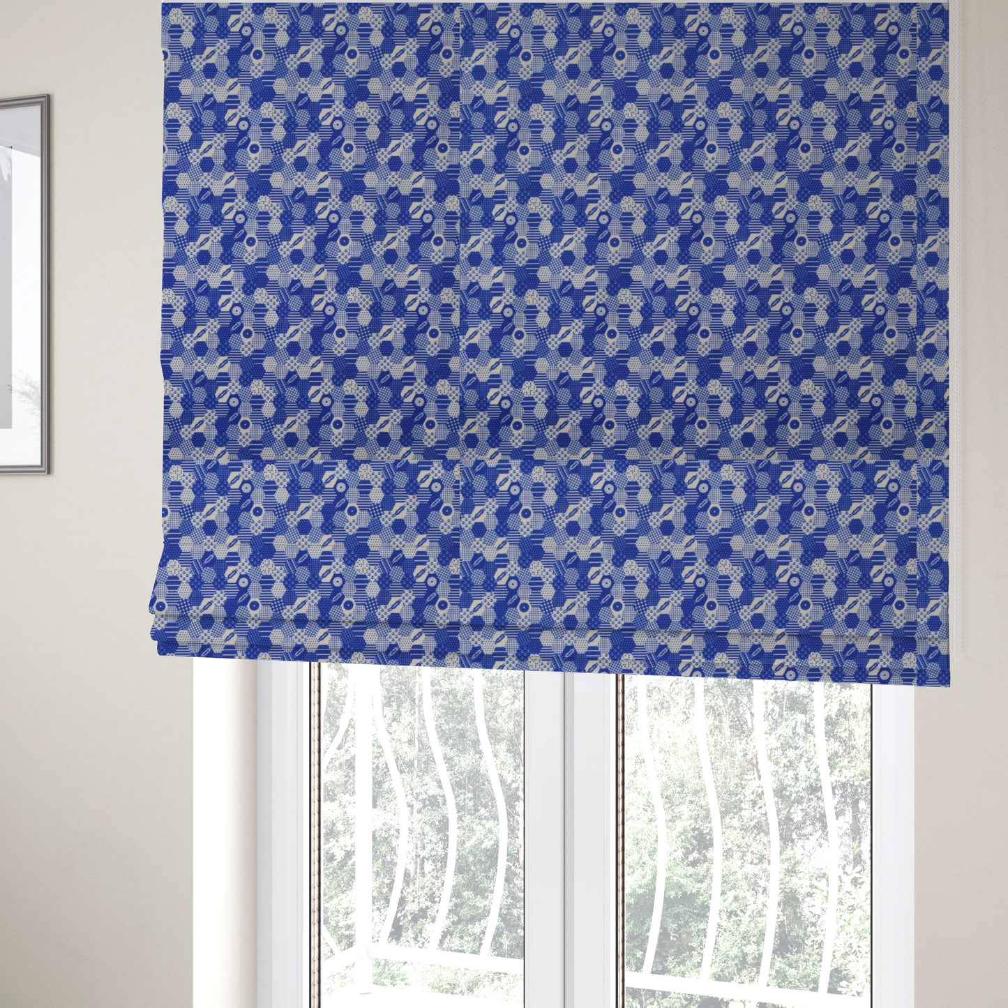The fabric used to create these Roman blinds is a detailed geometric fabric featuring a dense honeycomb or hexagonal patchwork pattern in blue and white.
