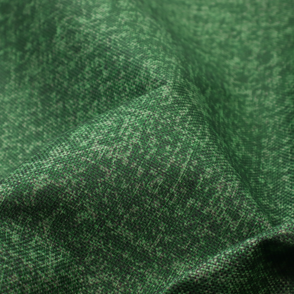 This fabric has a low contrast between the base colour and the print, the design reveals more detail upon closer inspection, offering a rich and understated elegance in different green tones.