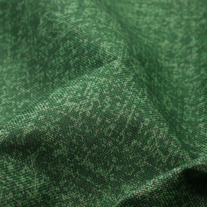 This fabric has a low contrast between the base colour and the print, the design reveals more detail upon closer inspection, offering a rich and understated elegance in different green tones.