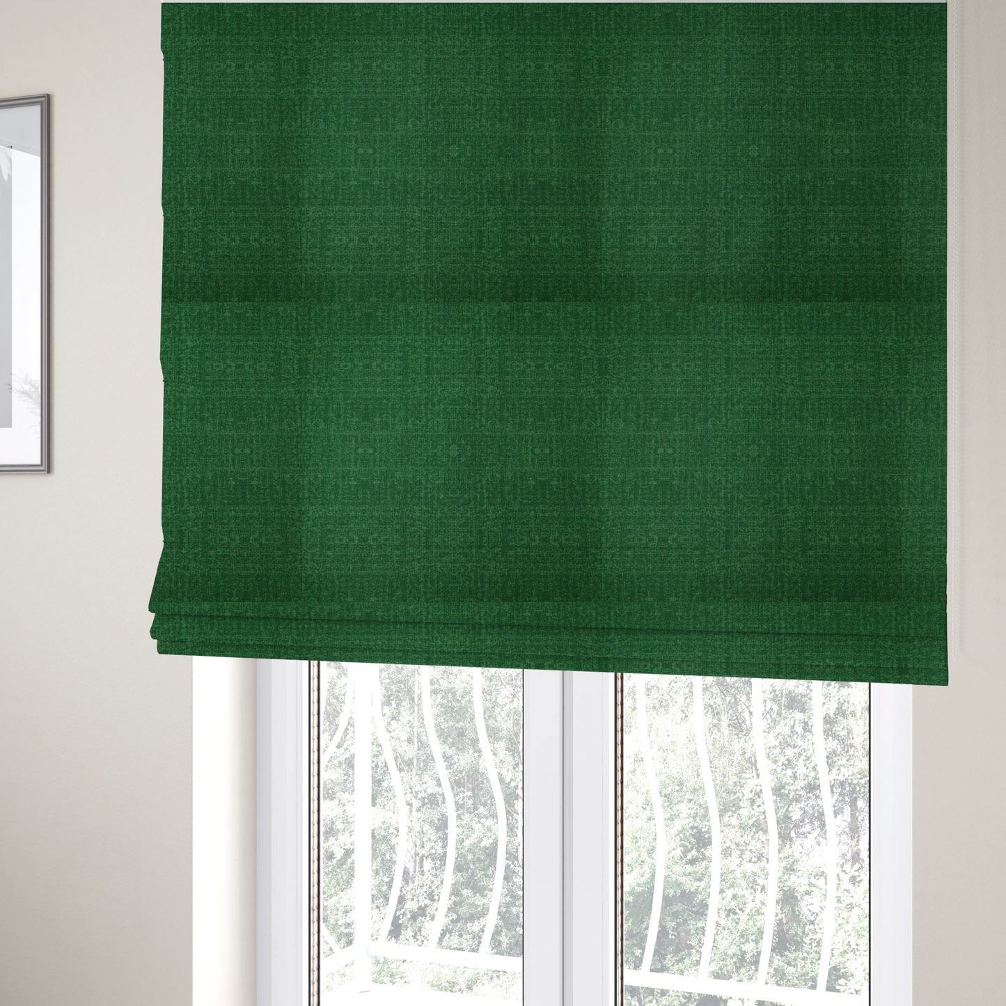The fabric used to create these Roman blinds has a low contrast between the base colour and the print, the design reveals more detail upon closer inspection, offering a rich and understated elegance in different green tones.
