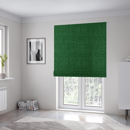 The fabric used to create these Roman blinds has a low contrast between the base colour and the print, the design reveals more detail upon closer inspection, offering a rich and understated elegance in different green tones.