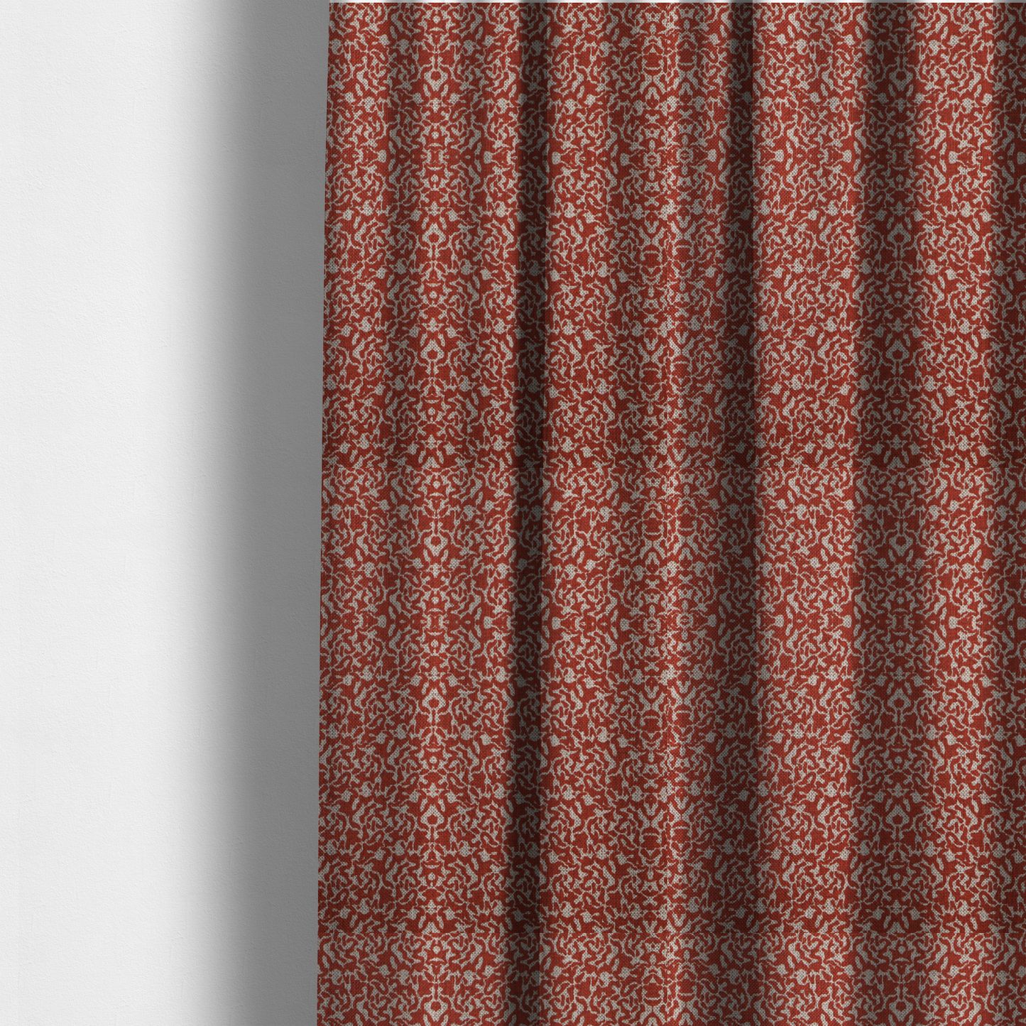 The fabric used to create these made-to-measure curtains is a decorative textile featuring a symmetrical, kaleidoscopic pattern in red and beige. The intricate, interlocking organic shapes create a dense, filigree-like design with a slightly weathered or distressed look. The fabric has a visible, fine-textured weave that gives the pattern a soft, matte appearance.