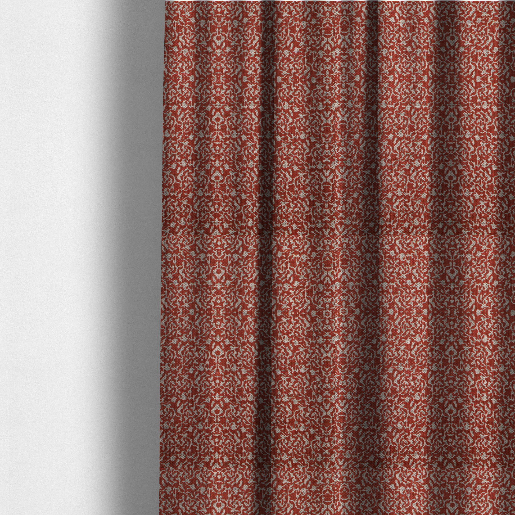 The fabric used to create these made-to-measure curtains is a decorative textile featuring a symmetrical, kaleidoscopic pattern in red and beige. The intricate, interlocking organic shapes create a dense, filigree-like design with a slightly weathered or distressed look. The fabric has a visible, fine-textured weave that gives the pattern a soft, matte appearance.
