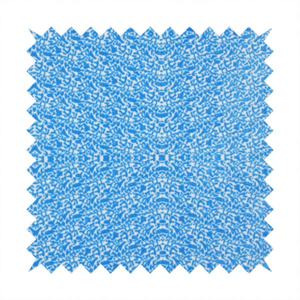 This fabric is a symmetrical, kaleidoscopic textile pattern in bright azure blue and white. The design features intricate, interlocking organic shapes mirrored vertically and horizontally to create a dense, mosaic-like filigree across the fabric.