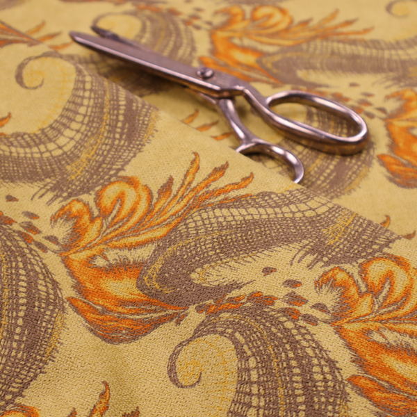 A repeating pattern of large, curved scroll shapes that look like stylized seashells or feathers. These shapes feature a grey crosshatch 'grid' texture and are decorated with bright orange and gold accents. The entire design is set against a solid, warm tan background.