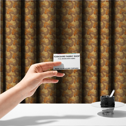 The fabric used to create these made-to-measure curtains is a repeating pattern of large, curved scroll shapes that look like stylized seashells or feathers. These shapes feature a grey crosshatch 'grid' texture and are decorated with bright orange and gold accents. The entire design is set against a solid, warm tan background.