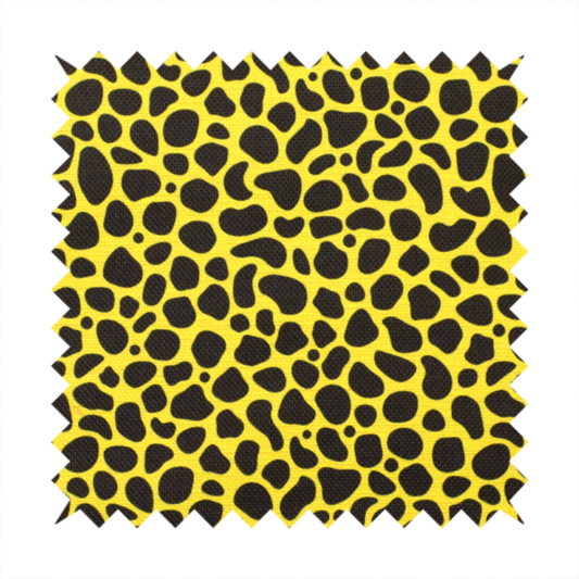 A bold cheetah-style animal print featuring irregular, black organic spots scattered across a bright canary yellow background.