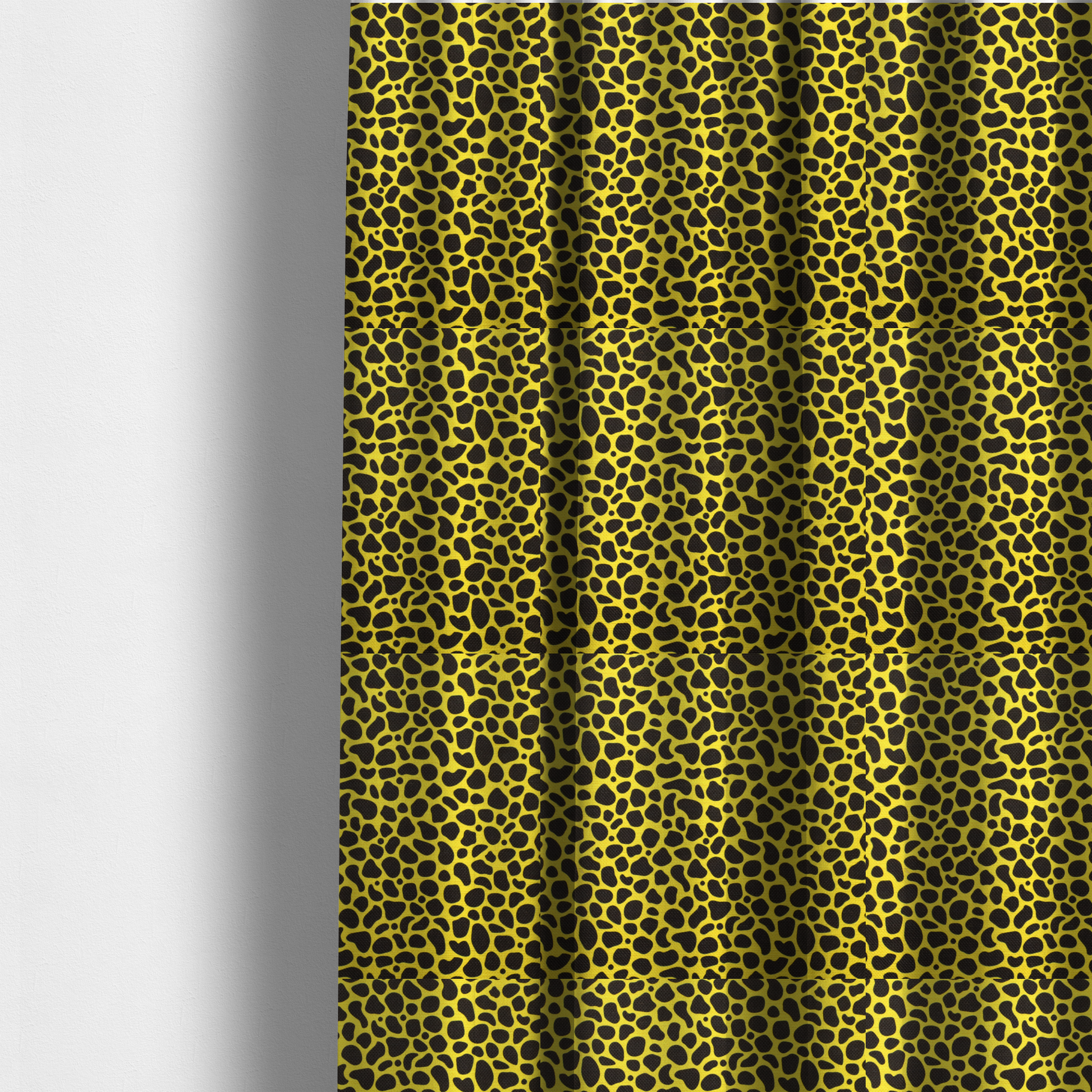 The fabric used to create these made-to-measure curtains is a bold cheetah-style animal print featuring irregular, black organic spots scattered across a bright canary yellow background.