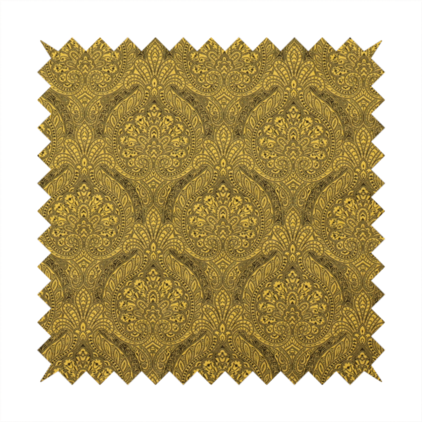 An intricate textile pattern featuring elaborate paisley-style medallions in black line work over an antique gold background. The design is highly detailed with swirling filigree, floral elements, and a repeating teardrop composition that creates a classic, traditional aesthetic.