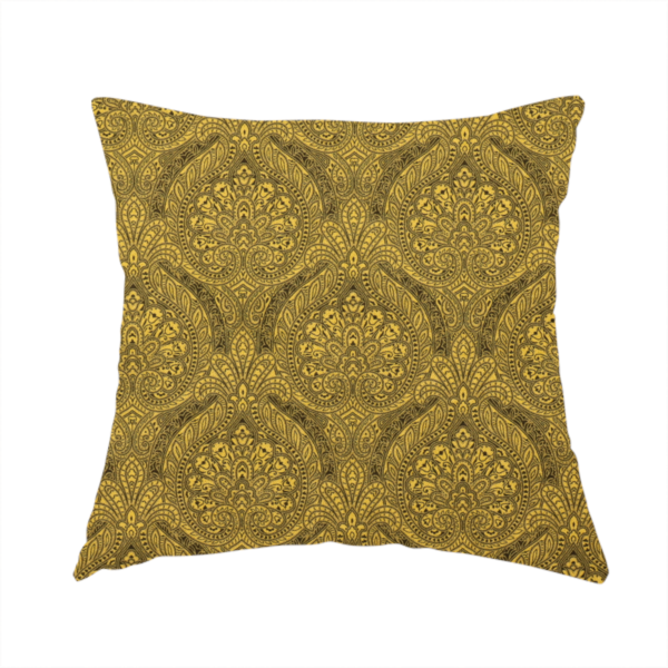 The fabric used to create these handmade cushions is an intricate textile pattern featuring elaborate paisley-style medallions in black line work over an antique gold background. The design is highly detailed with swirling filigree, floral elements, and a repeating teardrop composition that creates a classic, traditional aesthetic.