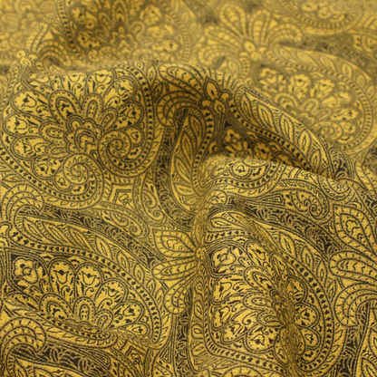 An intricate textile pattern featuring elaborate paisley-style medallions in black line work over an antique gold background. The design is highly detailed with swirling filigree, floral elements, and a repeating teardrop composition that creates a classic, traditional aesthetic.