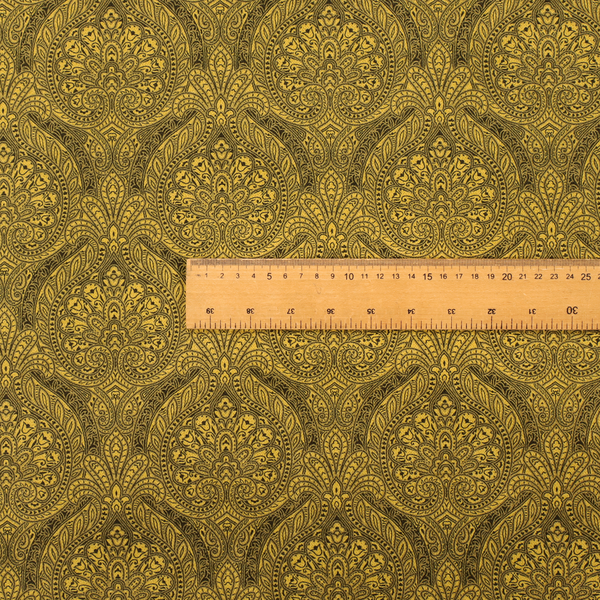 An intricate textile pattern featuring elaborate paisley-style medallions in black line work over an antique gold background. The design is highly detailed with swirling filigree, floral elements, and a repeating teardrop composition that creates a classic, traditional aesthetic.