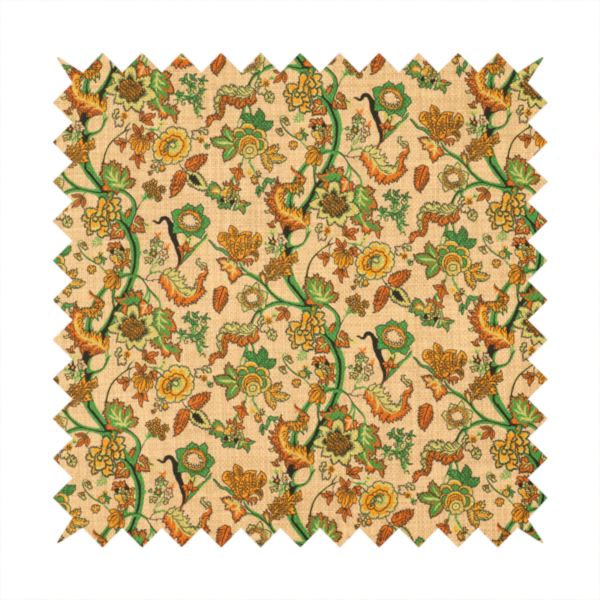 A vintage-style fabric featuring winding green vines and various floral blossoms in shades of orange, gold, and yellow. The pattern is set against a light beige, canvas-textured background, with a bohemian or arts-and-crafts aesthetic.