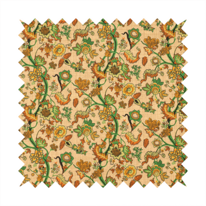 A vintage-style fabric featuring winding green vines and various floral blossoms in shades of orange, gold, and yellow. The pattern is set against a light beige, canvas-textured background, with a bohemian or arts-and-crafts aesthetic.