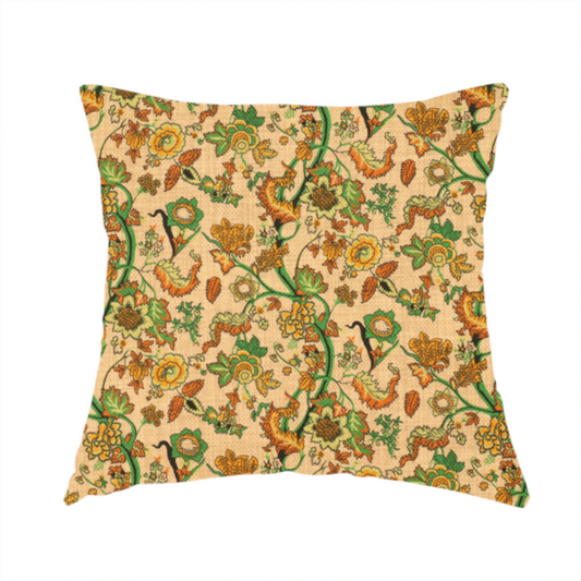 The fabric used to create this handmade cushions is a vintage-style fabric featuring winding green vines and various floral blossoms in shades of orange, gold, and yellow. The pattern is set against a light beige, canvas-textured background, with a bohemian or arts-and-crafts aesthetic.