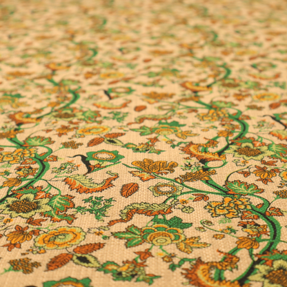 A vintage-style fabric featuring winding green vines and various floral blossoms in shades of orange, gold, and yellow. The pattern is set against a light beige, canvas-textured background, with a bohemian or arts-and-crafts aesthetic.