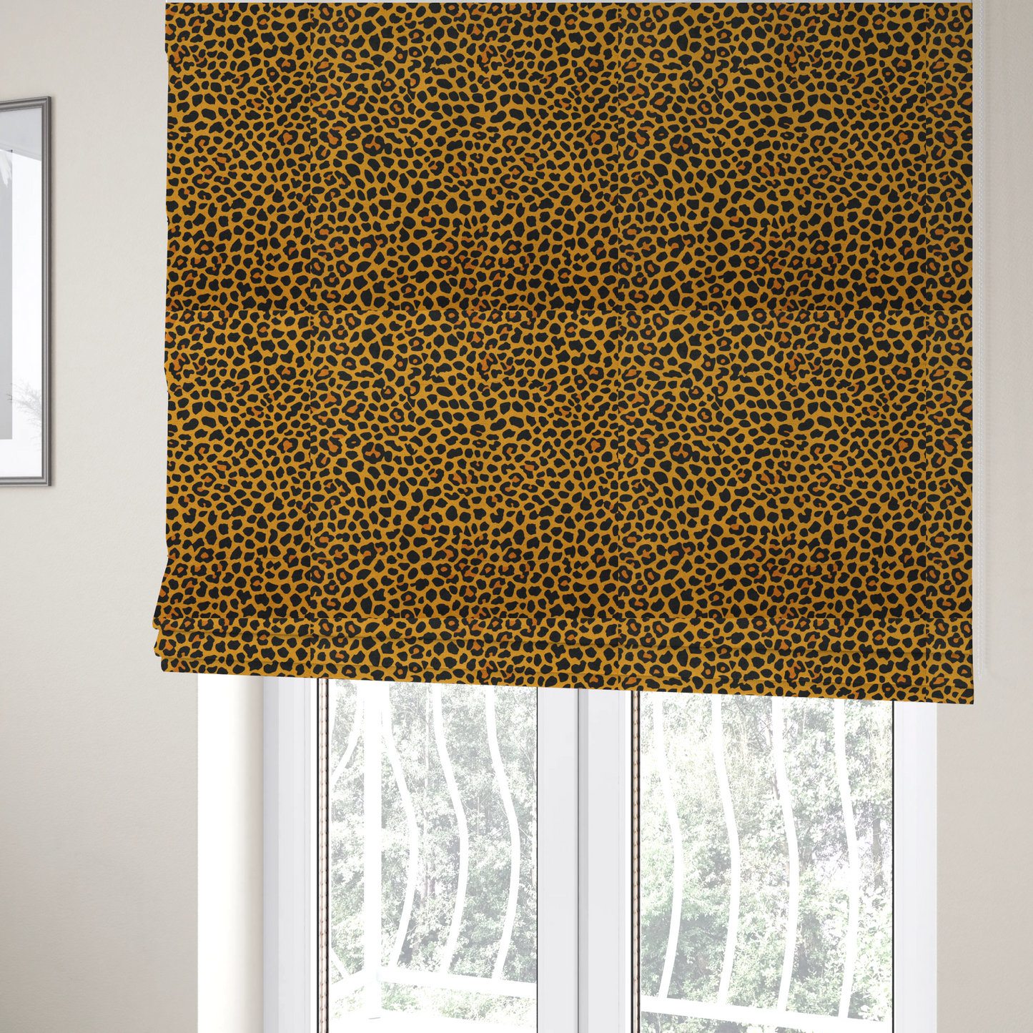 The fabric used to create these Roman blinds is a high-contrast animal print fabric featuring a dense leopard-inspired pattern. The design consists of irregular black spots and open rosettes with warm orange-brown centres, set against a vibrant mustard-yellow background. The print is small-scale and tightly packed, with a visible fine-grained textile texture