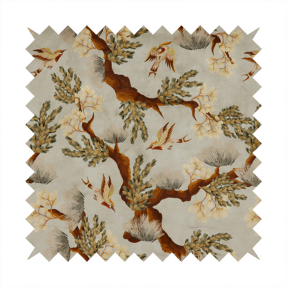 A sophisticated textile featuring a Chinoiserie-style pattern with stylized birds in flight among winding, dark brown tree branches. The branches are adorned with clusters of pale cream blossoms and soft, pine-like needles. The entire design is set against a muted beige background creating a serene and classical aesthetic.