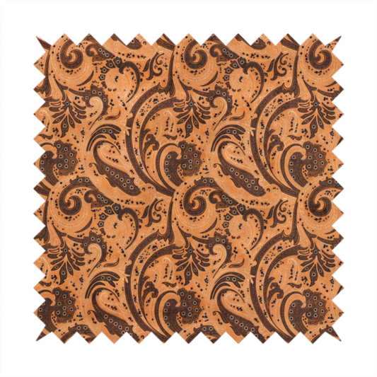 A complex textile design featuring an all-over paisley and scroll pattern in solid black over a warm copper-orange background. The motifs are highly stylized with a mixture of dotted textures, fine line work, and bold curves that resemble ocean waves or flowing vines. The high-contrast colour palette gives the fabric a sophisticated, bohemian-luxe appearance.