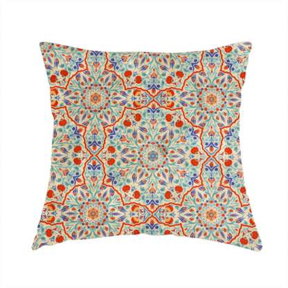 The fabric used to create this handmade cushion is a decorative fabric with an Ottoman-style floral print. The design consists of repeating cobalt blue and turquoise tulips and deep red carnations intertwined with long, curving green leaves. The pattern mimics 16th-century Mediterranean ceramic tile art.