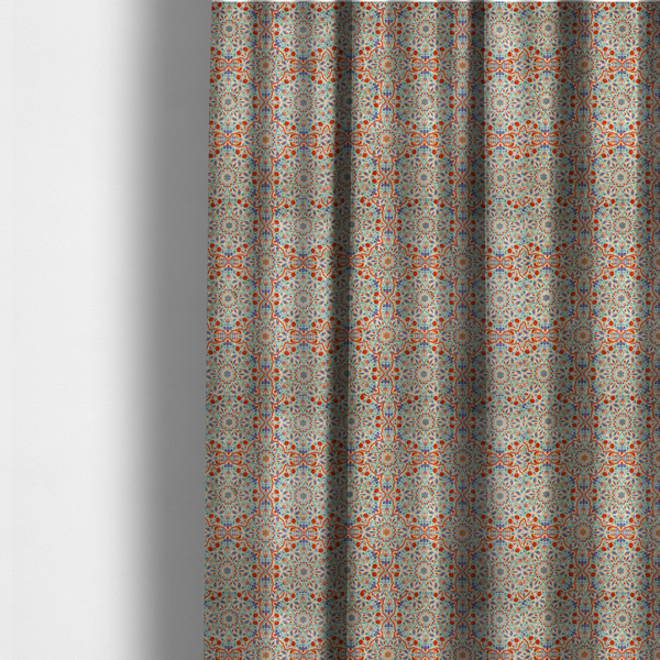 The fabric used to create these made-to-measure curtains is a decorative fabric with an Ottoman-style floral print. The design consists of repeating cobalt blue and turquoise tulips and deep red carnations intertwined with long, curving green leaves. The pattern mimics 16th-century Mediterranean ceramic tile art.