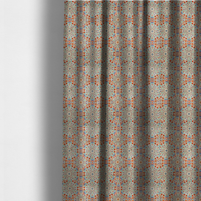 The fabric used to create these made-to-measure curtains is a decorative fabric with an Ottoman-style floral print. The design consists of repeating cobalt blue and turquoise tulips and deep red carnations intertwined with long, curving green leaves. The pattern mimics 16th-century Mediterranean ceramic tile art.